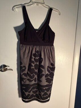 Short black dress with embroidered mesh overlay